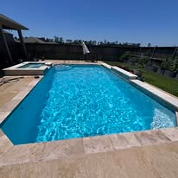 Clear blue backyard pool